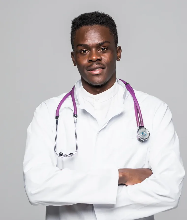 Doctor standing with arms folded